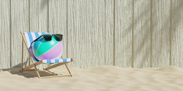 Beach ball with sunglasses on a beach chair with wooden background and beach sand