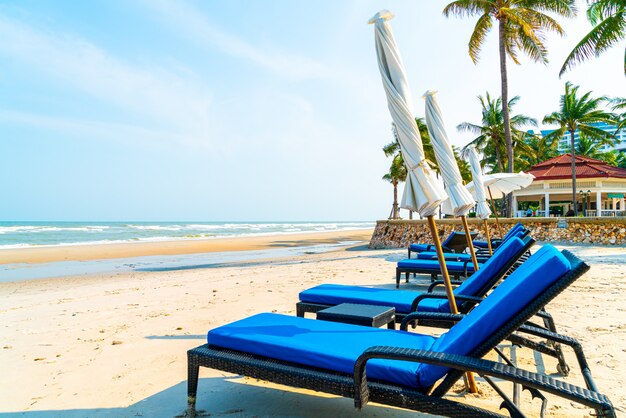 beach chair on beach with sea and blue sky