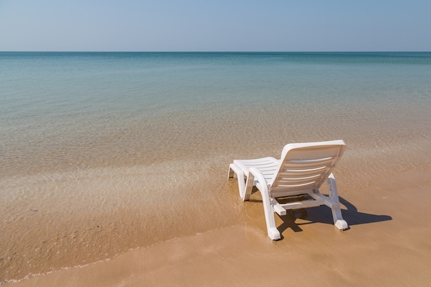 Beach chair at sunny coast at the beach background