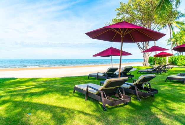 beach chair and umbrella with ocean sea beach