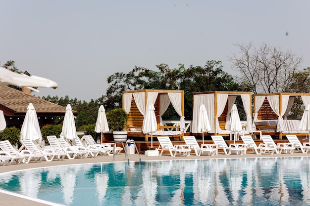 Beach chairs and umbrellas sunbeds bungalows and beach umbrella