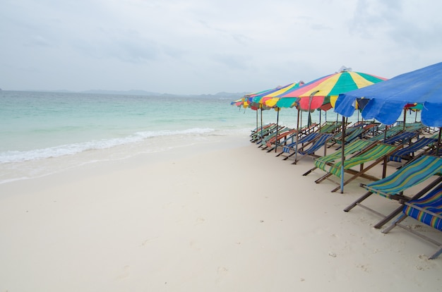 Beach chairs with umbrella and beautiful beach.Khai Nok Island Phuket