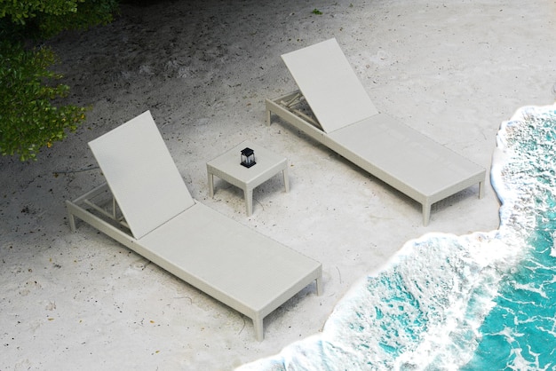 Beach chairs with wave on sea