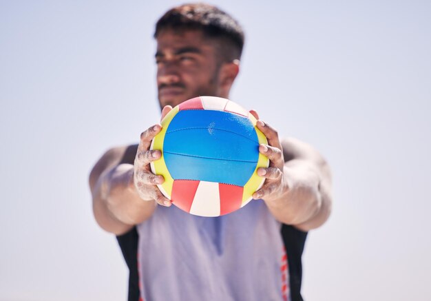 Photo beach fitness or man with volleyball to serve for game workout training or sports training in summer thinking athlete or hands of player holding ball ready to start contest or exercise at ocean