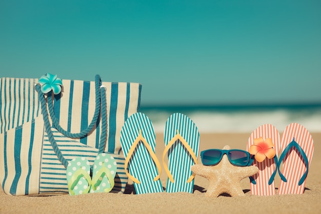 Beach flipflops on the sand Summer vacation concept