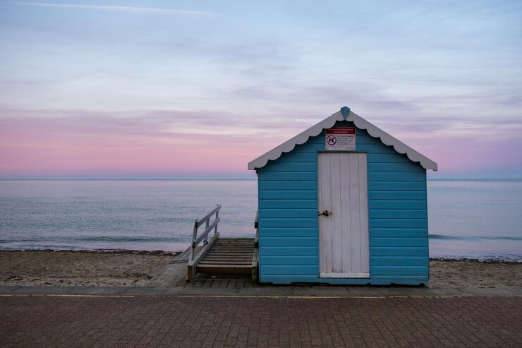 Photo beach hut by sea against sky during sunset