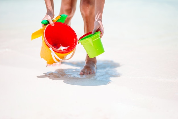 Beach kid's toys on white sand beach