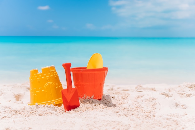 Beach kid's toys on white sand beach