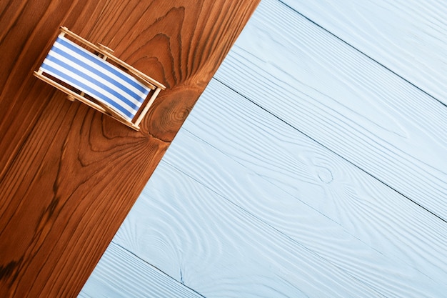 Beach miniature of colored wooden background