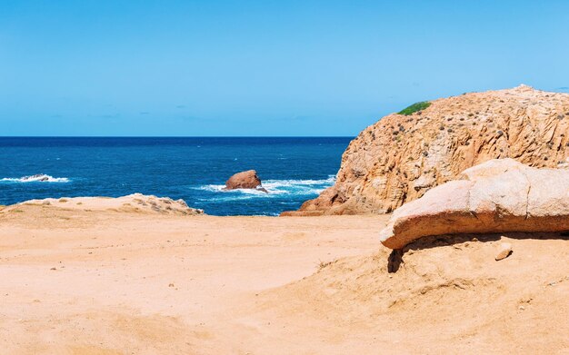 Beach near the Mediterranean sea in Buggerru, Carbonia-Iglesias province, in Sardinia, Italy