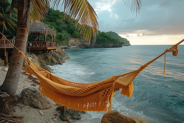 Beach scene with a hammock hanging over the water