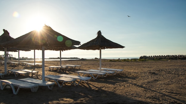 Beach and straw umbrellas