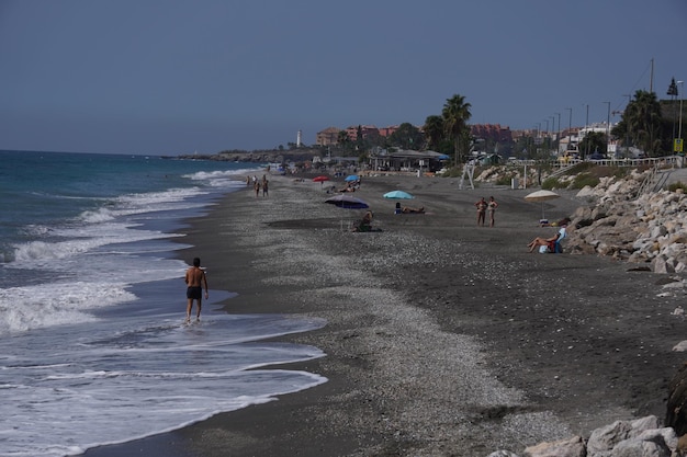 beach in summer in torrox spain with people