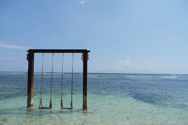 Photo beach swing on beautifull beach