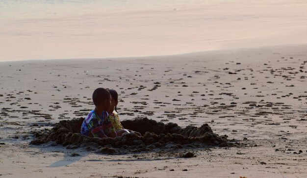 At the beach there are children and tourists on the beach on vacationRecorded March 10 2023 in Rayong Thailand