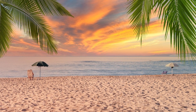 Beach umbrellas at dramatic sunset