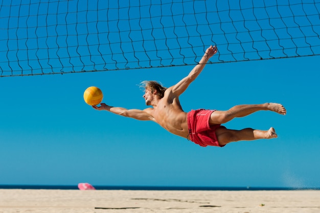 Beach volleyball - man jumping