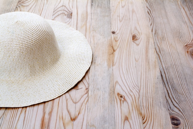 beach white hat on clear pine wood