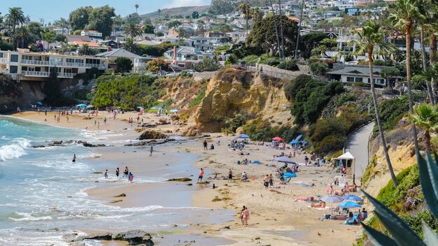 a beach with a beach and a city in the background