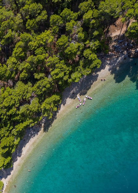 beach with boats on the emerald sea aerial view Makarska riviera in Dalmatia Croatia
