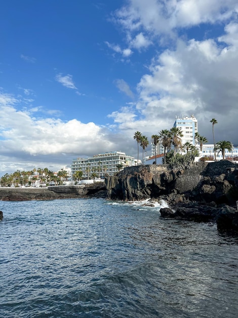 A beach with a building in the background