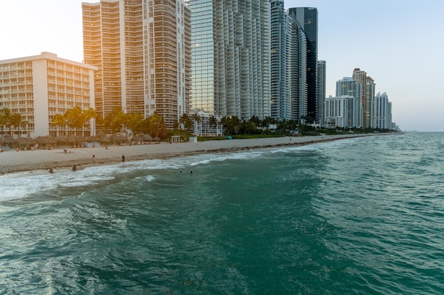 A beach with buildings in the background