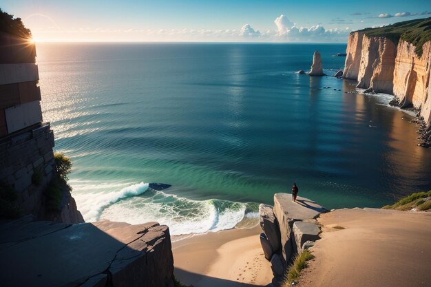 A beach with a cliff at the bottom and a man standing on the edge of the cliff.