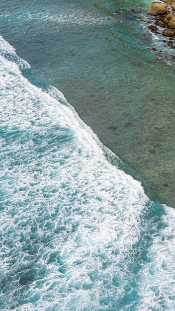 A beach with a green island in the background