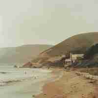 Photo a beach with a house on the side and a beach in the background