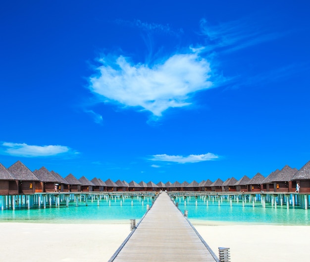 Beach with water bungalows at Maldives