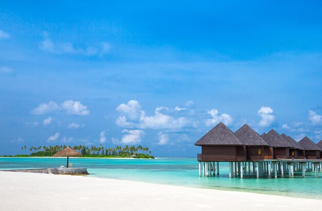 Beach with water bungalows at Maldives