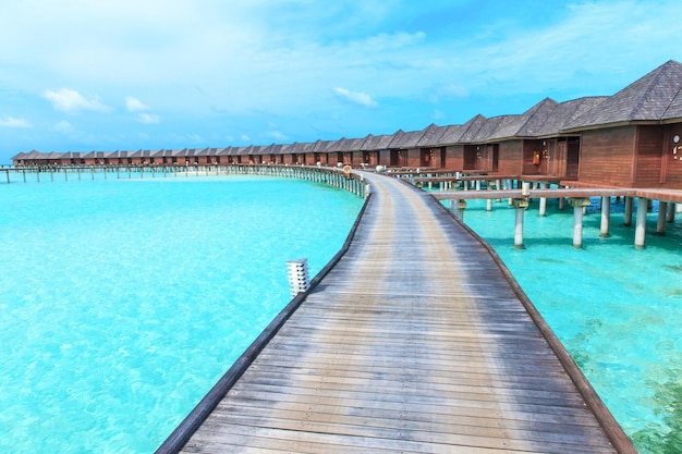 beach with water bungalows at Maldives