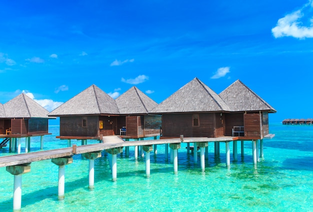 Beach with water bungalows in Maldives