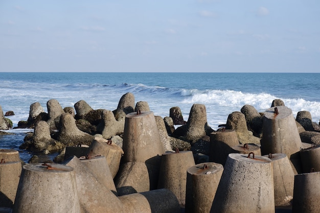 beach with wave breaker concrete