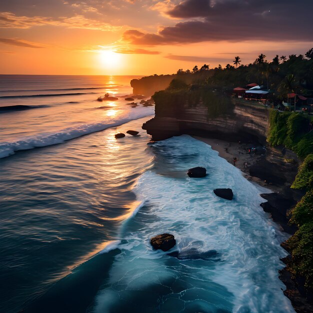 A beach with waves crashing against the rocks and the sun setting