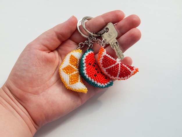 Bead colorful key chains in a female hand