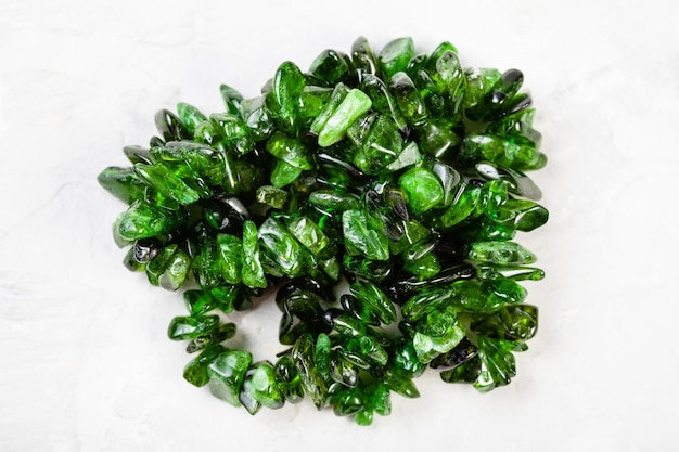 Beads from chrome diopside crystals on gray