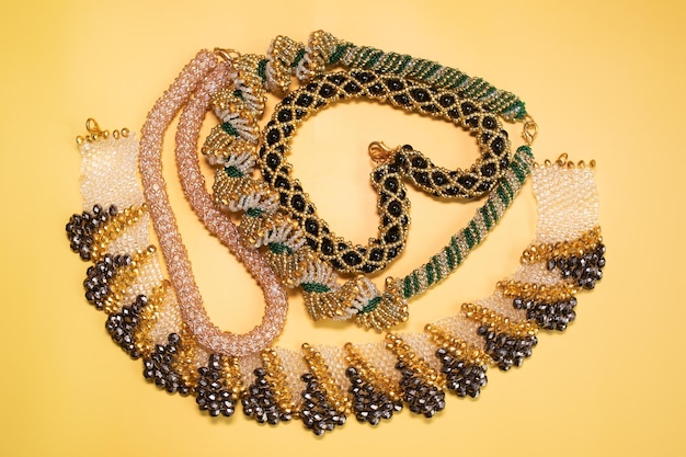 Beads, Jewelery, beads necklace on yellow background.