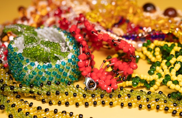 Beads, Jewelery, beads necklace on yellow background.