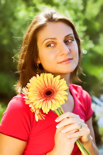 Beaituful woman with gerber outdoor