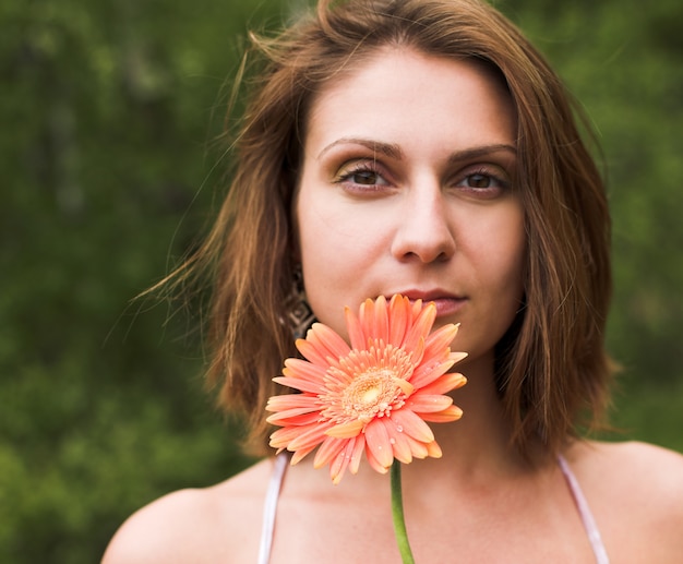 Beaituful woman with gerber outdoor