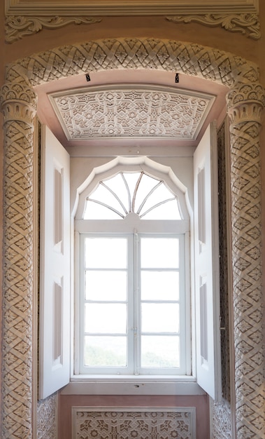 Beams of sunlight in the window inside in dark lodging