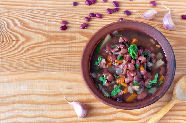 Bean soup with cilantro in bowl