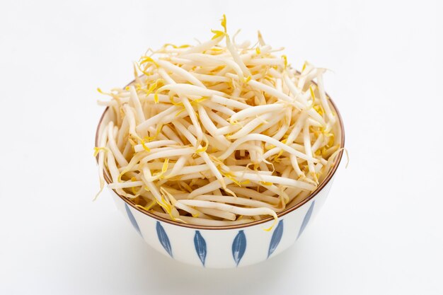 Bean sprouts in bowl on white background