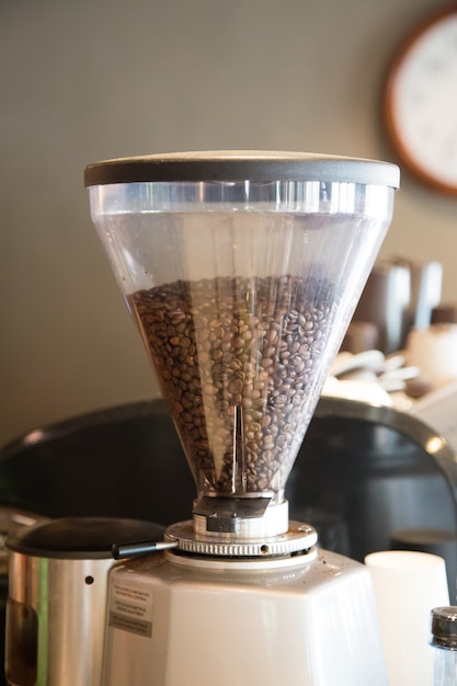 Photo beans in the grinder in coffee shop