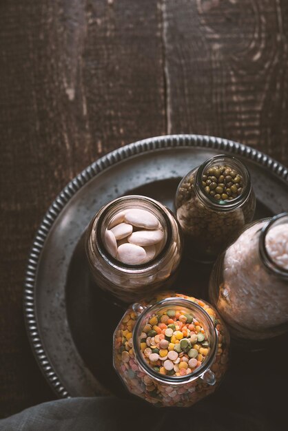 Beans lentils rice bottled on a tin plate