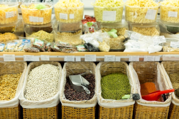 Beans, peas, chickpeas in crates in the supermarket.