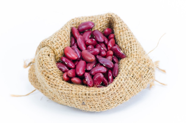 Beans in sack isolated on white