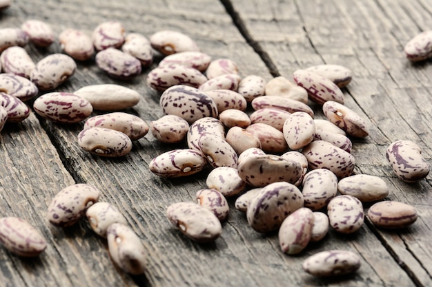 Beans on wooden background