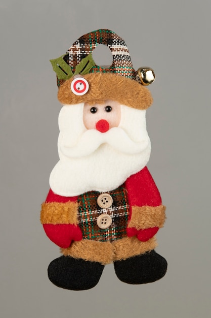 Bear-shaped rag doll used to decorate Christmas tree. . .